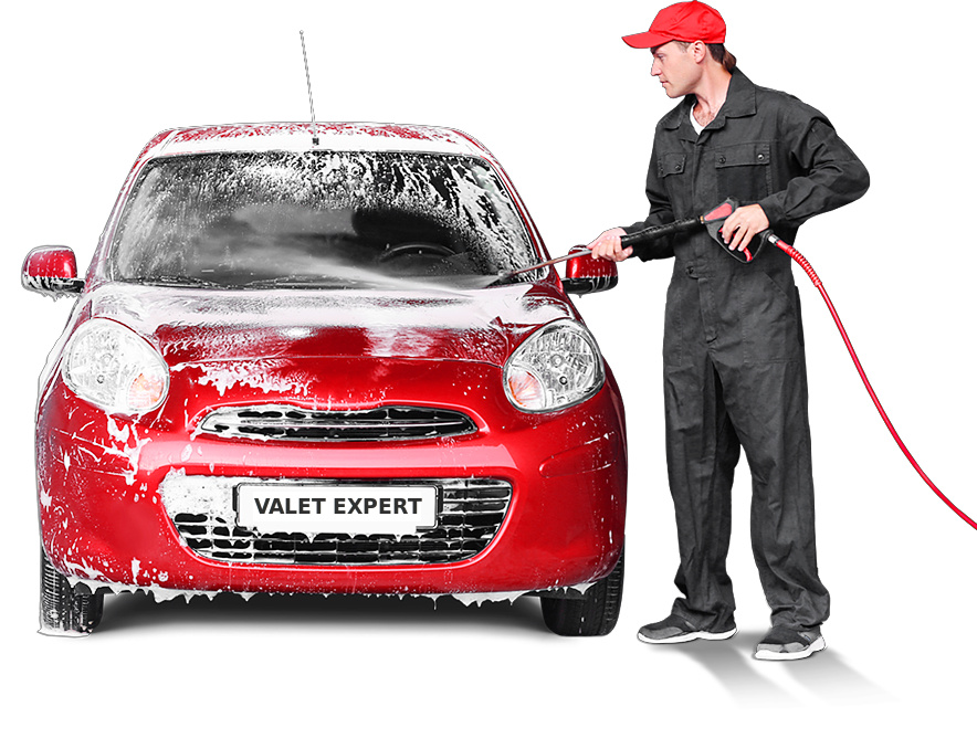 Man holding a jetwash spraying the windscreen and bonnet